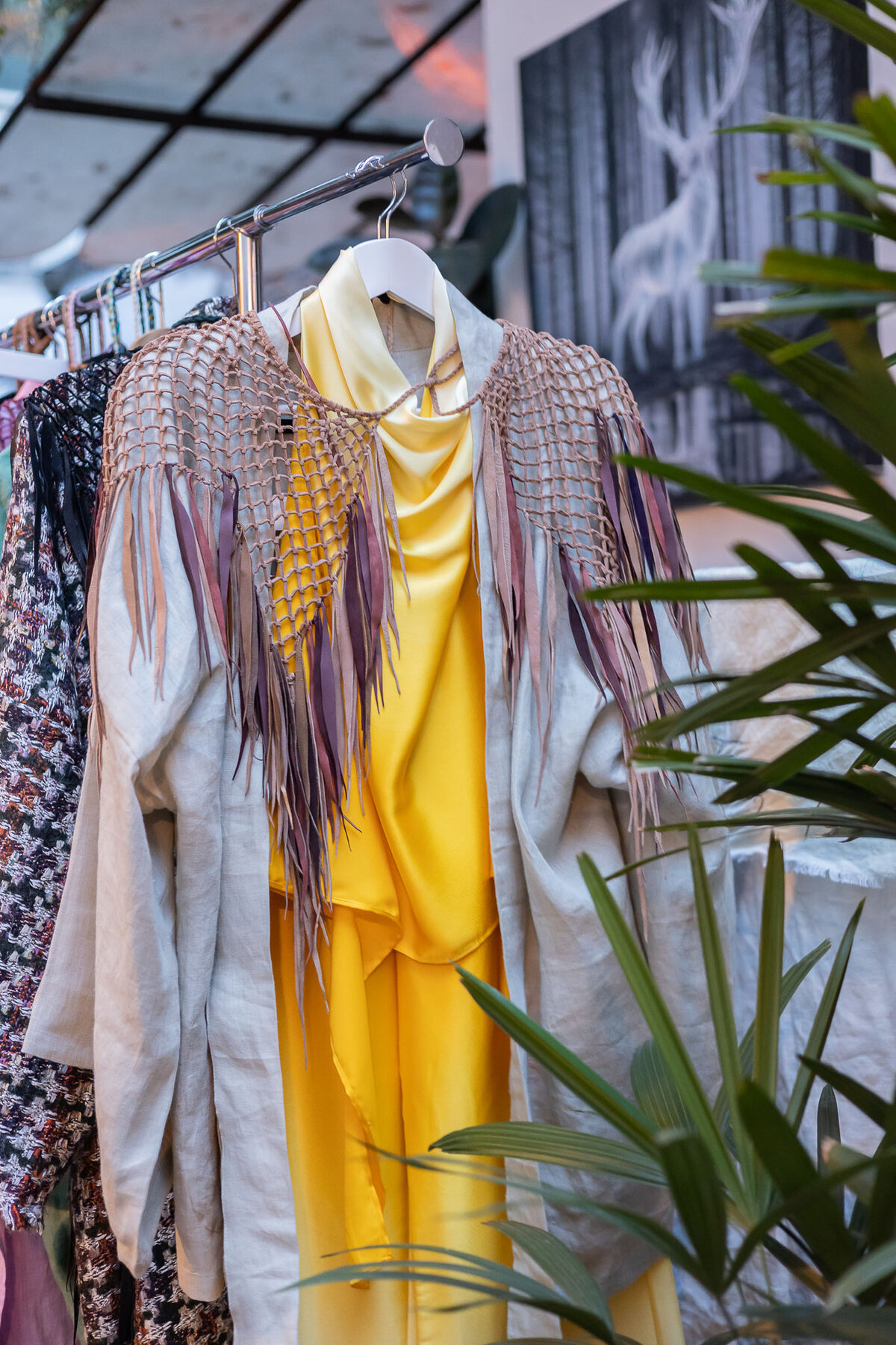 Robe detail with leather fringe and natural dye